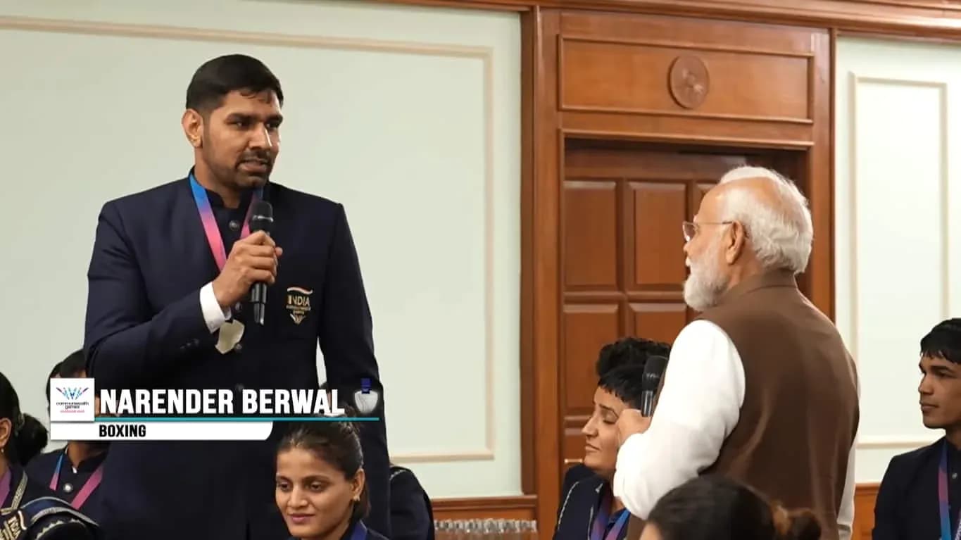Narender Berwal speaking at an event with audience Narender Berwal speaking at an event with audience