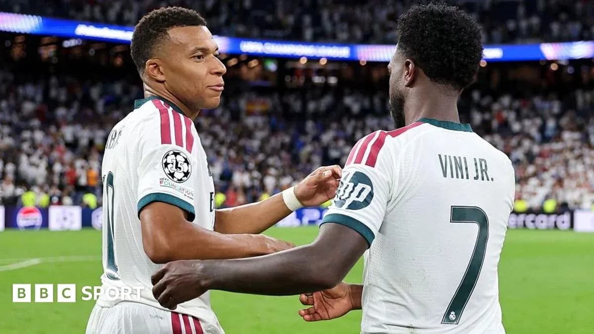 Mbappé and Viní Jr. celebrating on the pitch Mbappé and Viní Jr. celebrating on the pitch