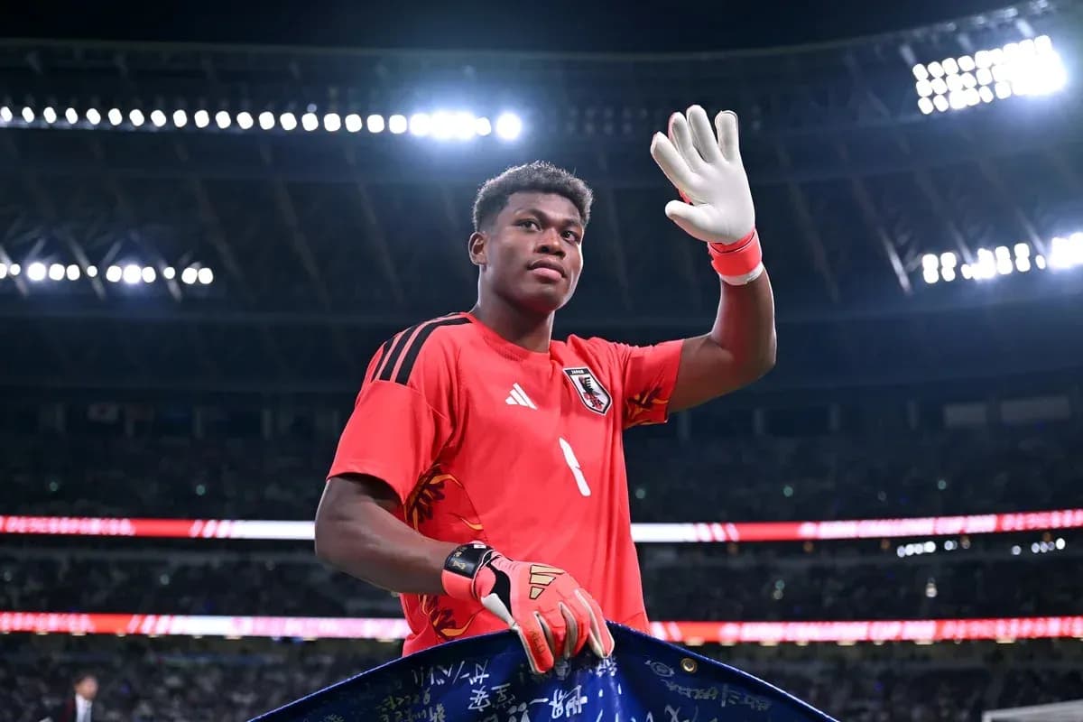 Goalkeeper waving with gloves at stadium Goalkeeper waving with gloves at stadium