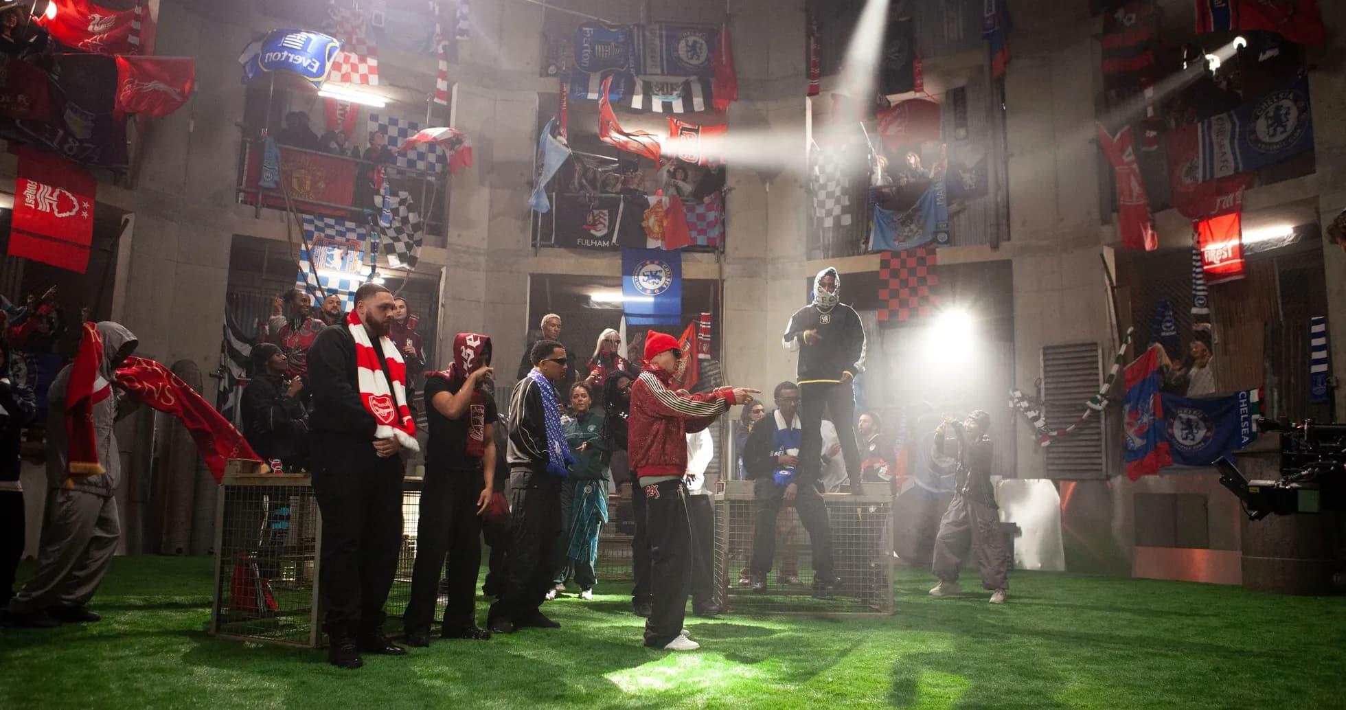 Fans in a venue with football team flags Fans in a venue with football team flags
