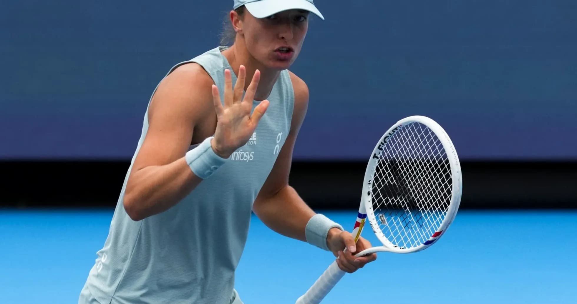 Tennis player gesturing during a match Tennis player gesturing during a match