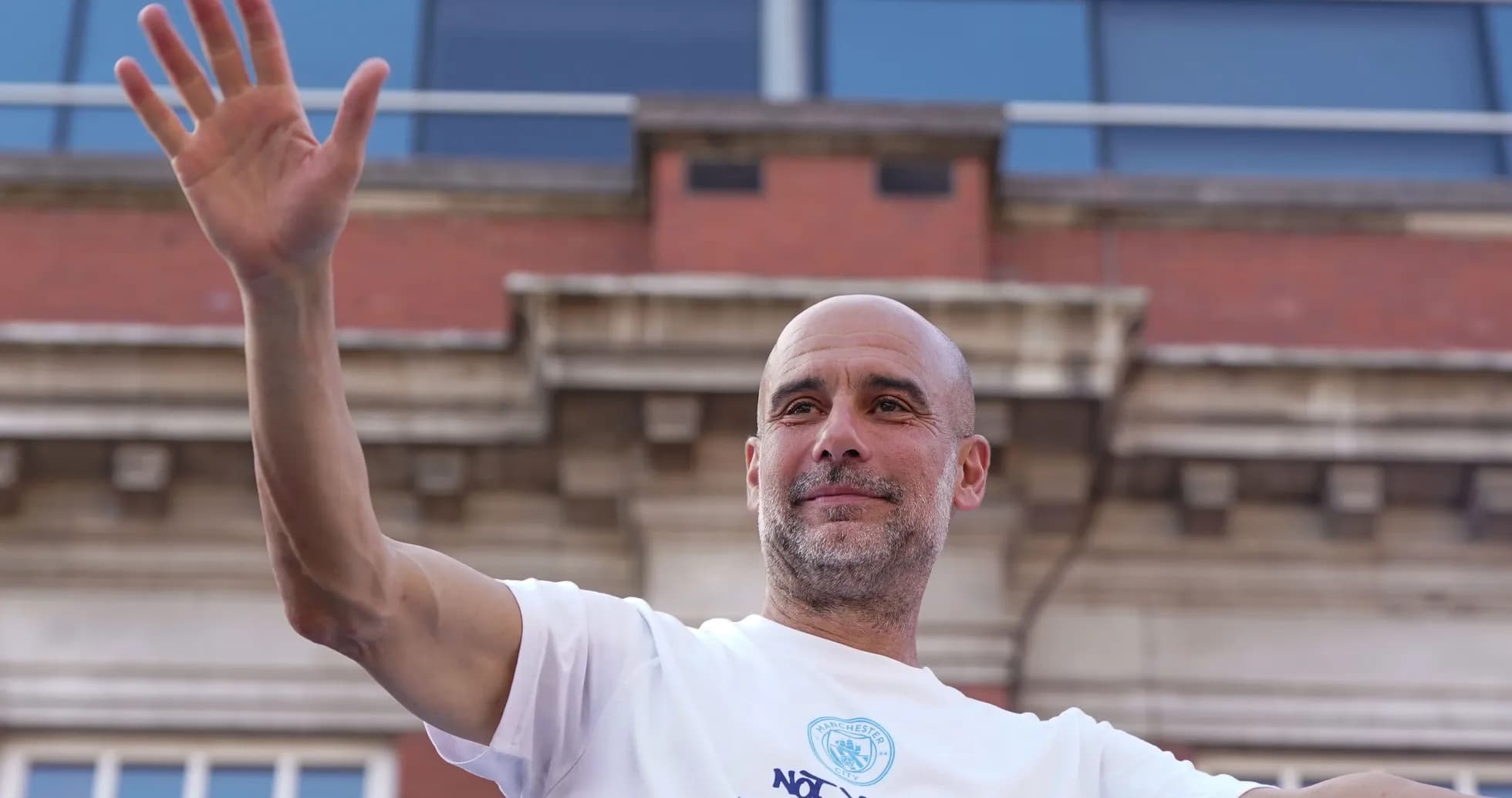 Person waving during a public celebration event Person waving during a public celebration event